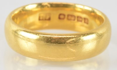 Lot 756 - A 22ct gold band ring, size M, approx 7.9g.