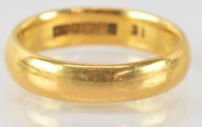 Lot 778 - A 22ct gold band ring, size J, approx 4.4g.