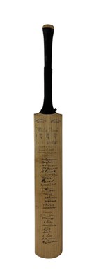 Lot 348 - A 1947 signed cricket bat, signed by the...