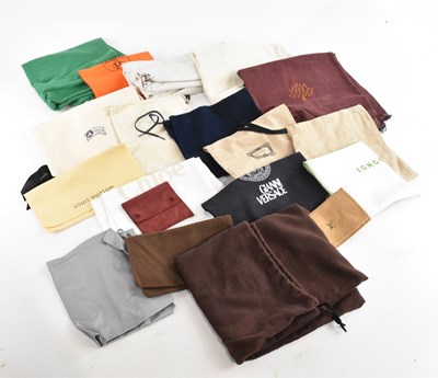 Lot 1928 - HERMÈS; a large cloth dust bag, an orange dust...