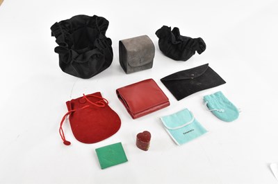 Lot 1946 - CARTIER; a red faux suede jewellery pouch, a...