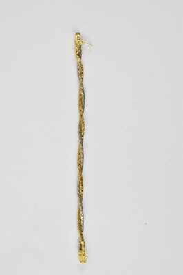Lot 732 - An 18ct gold bi-colour twist bracelet with box...