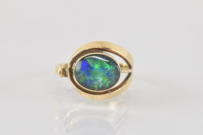 Lot 812 - A 10k gold contemporary ring with opal style...