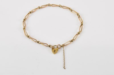 Lot 802 - A 9ct gold chain link bracelet, with 9ct gold...