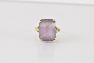 Lot 857 - A 9ct gold amethyst set dress ring, size M,...