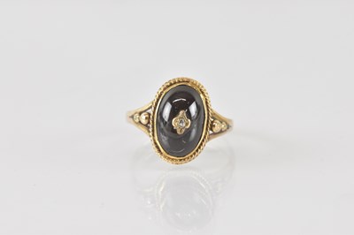 Lot 810 - A 9ct gold mourning ring, with tiny diamond to...