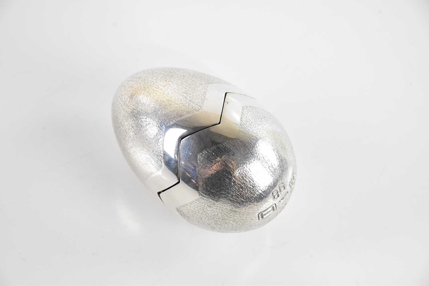 Lot 51 - BRUCE RUSSELL, GUERNSEY; a silver novelty egg,...