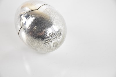 Lot 51 - BRUCE RUSSELL, GUERNSEY; a silver novelty egg,...