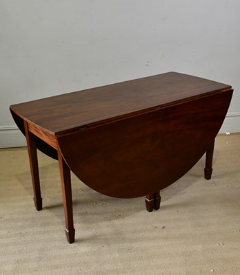 Lot 215 - A George III mahogany drop-leaf dining table,...