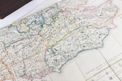 Lot 52 - A 19th century hand coloured linen backed...