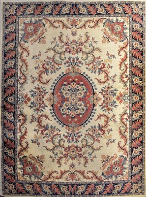 Lot 119 - A wool carpet of cream ground with...