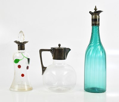 Lot 1409 - An electroplated topped claret jug and a...