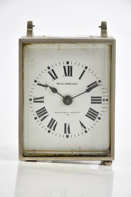 Lot 353 - WILLIAMS & CO; a travelling clock with white...