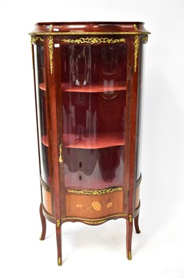 Lot 90 - A Louis XV style display cabinet, in mahogany...