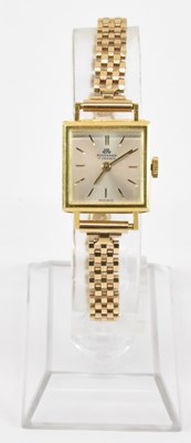 Lot 914 - BUCHERER; a lady's 18ct gold wristwatch, the...