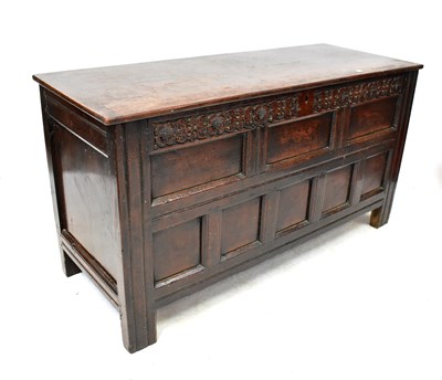 Lot 64 - A 19th century oak coffer with hinged lid...