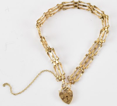 Lot 849 - A 9ct gold three bar gate bracelet with 9ct...