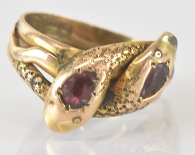 Lot 817 - A 9ct gold ring with crossover snake head,...