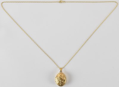 Lot 850 - A 9ct gold oval double locket pendant, with...