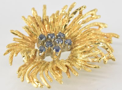 Lot 742 - An 18ct gold contemporary floral brooch, with...