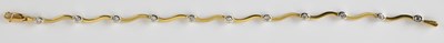 Lot 727 - An 18ct gold diamond set bracelet, the wavy...