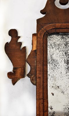 Lot 107 - A Georgian walnut framed fret carved wall...