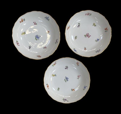 Lot 481 - MEISSEN; a set of three white ground porcelain...