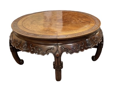 Lot 545 - A Chinese carved hardwood circular coffee...