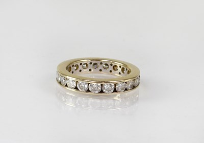 Lot 832 - An 18ct gold diamond eternity ring, size N,...
