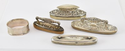 Lot 714 - Four George V hallmarked silver nail buffers...