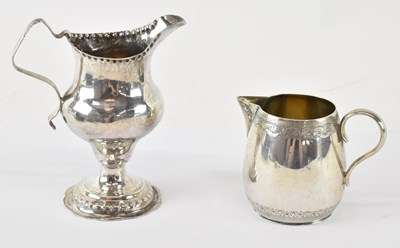 Lot 652 - A George III hallmarked silver cream jug,...