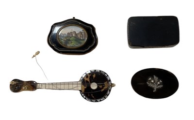 Lot 319 - A tortoiseshell and mother of pearl inlaid...