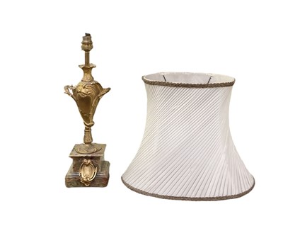 Lot 112 - A gilt metal and onyx table lamp with white...