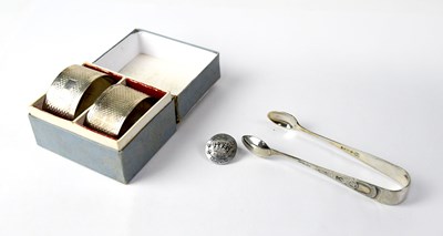 Lot 695 - A pair of boxed hallmarked silver napkin rings