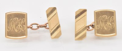Lot 855 - A pair of 9ct yellow gold cufflinks, combined...