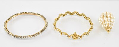 Lot 747 - Two yellow metal seed pearl set bangles,...