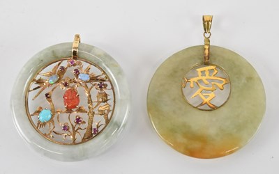 Lot 776 - A Chinese 14ct yellow gold mounted green jade...