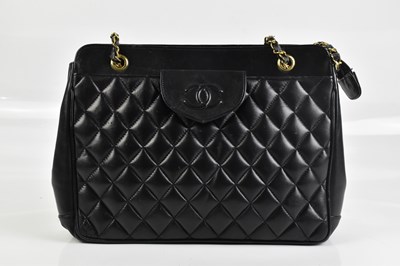Lot 2017 - CHANEL; a 1960s/70s vintage black calfskin...