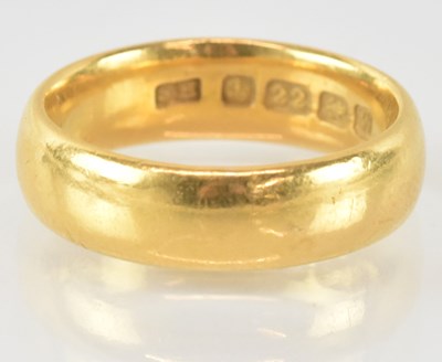 Lot 757 - A 22ct gold band ring, size J, approx 6.8g.