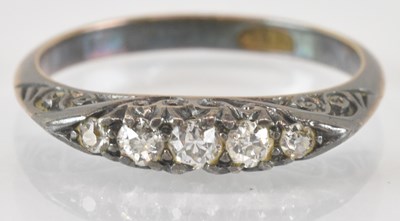 Lot 818 - An 18ct white gold diamond set ring, the top...