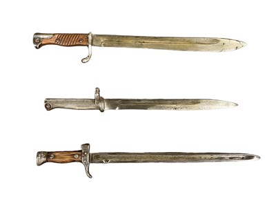 Lot 339 - A WWII bayonet, length 51cm, and two further...