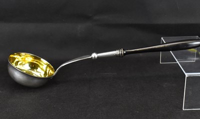 Lot 683 - A silver soup ladle with gilt inner bowl, pin...