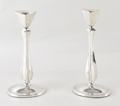 Lot 611 - A pair of Danish silver plated candlesticks of...