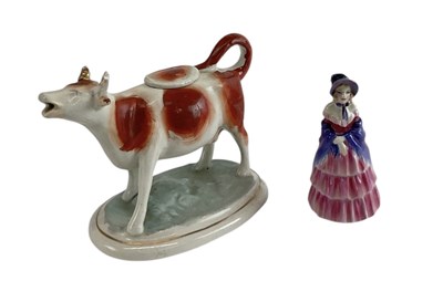 Lot 486 - ROYAL DOULTON; a small porcelain figure, 'A...