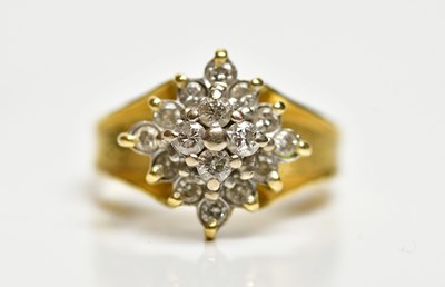 Lot 1347 - An 18ct yellow gold diamond cluster ring, with...