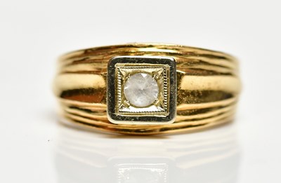 Lot 1349 - A yellow metal ring with diamond set to the...