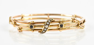 Lot 1564 - A 9ct yellow gold sapphire and seed pearl oval...