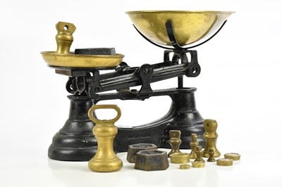 Lot 2640 - A brass and iron set of scales, stamped 'Made...