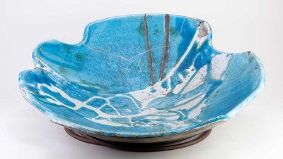 Lot 488 - A large shallow raku bowl covered in turquoise...