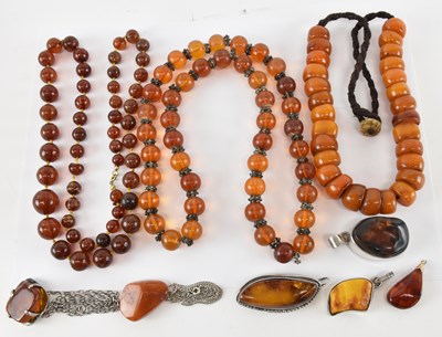 Lot 821 - Three amber bead effect necklaces, three...